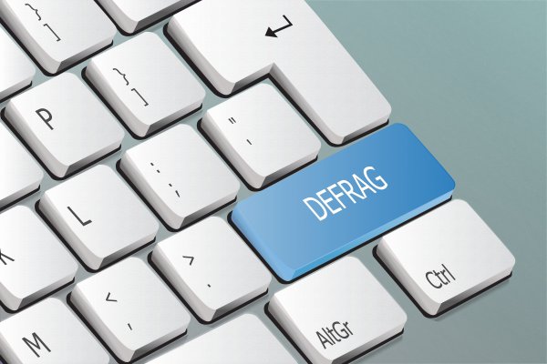 computer defrag blue key on white keyboard